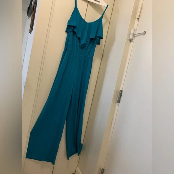 Pretty jumpsuit with ruffle collar tiny straps and elastic waist comfy material. - Picture 1 of 1
